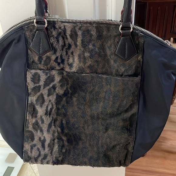 Leopard print with the feel of fur.MZ Wallace purse.Red trim with black handles. - Picture 3 of 7